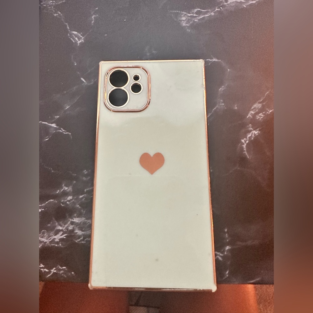 Teal phone case with gold highlights for an iPhone 12